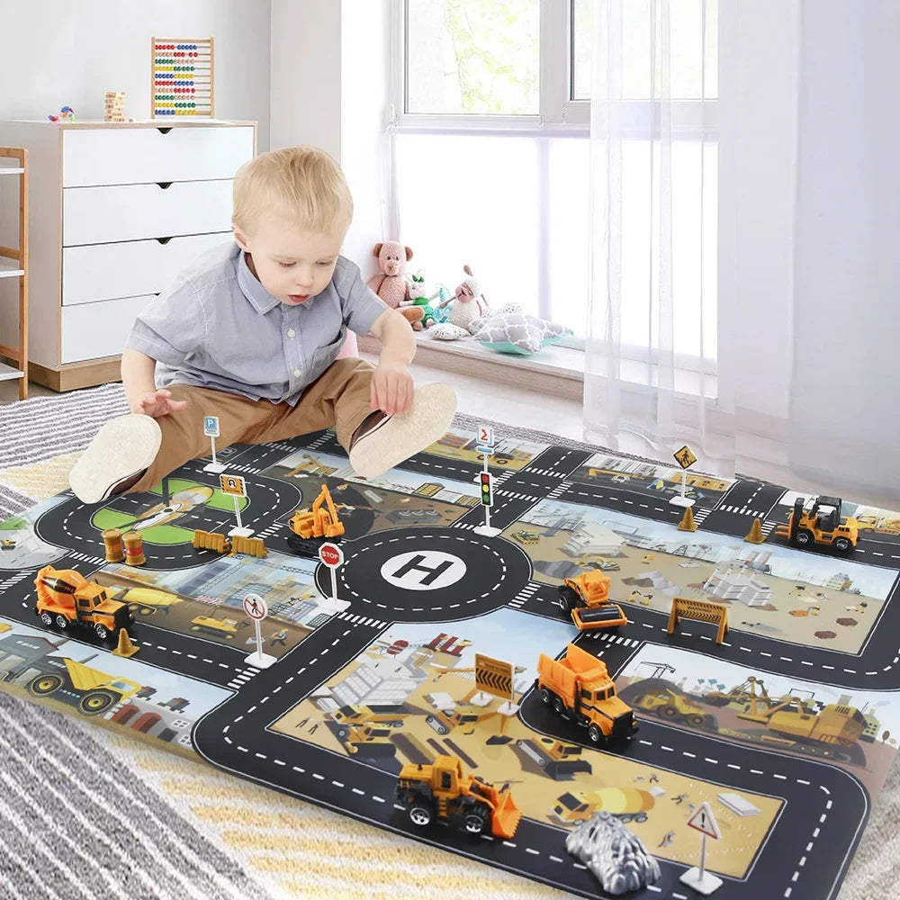 Child playing with toy construction vehicles on a large road map play mat in a room.