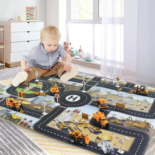 Child playing with toy construction vehicles on a large road map play mat in a room.